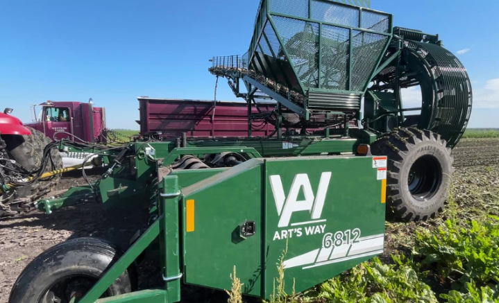 Art's Way beet harvester pulled by a case tractor during sugar beet harvest