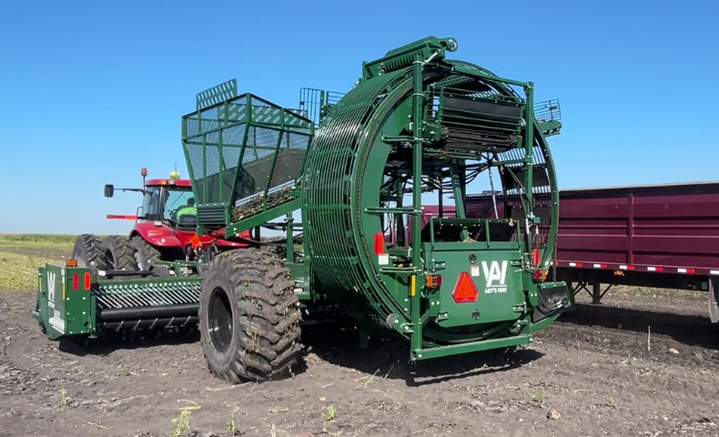 Art's Way beet harvester pulled by a case tractor during sugar beet harvest
